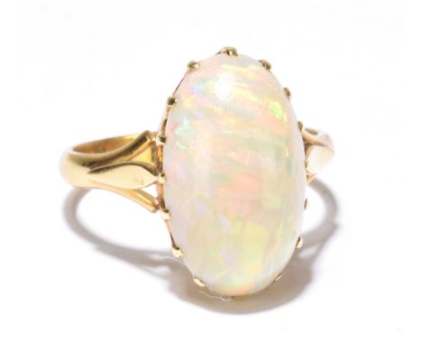 An 18ct yellow gold and large opal ring with pierced shoulders, size S, approx 6.2g.Additional InformationThe opal has a good