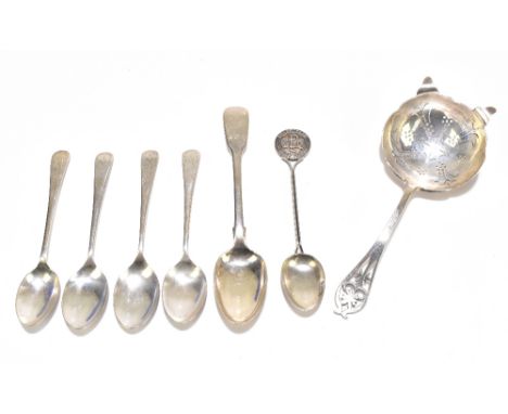 VINERS LTD; a hallmarked silver tea strainer, with pierced handle, Sheffield 1957, with five gold plated teaspoons and one ot