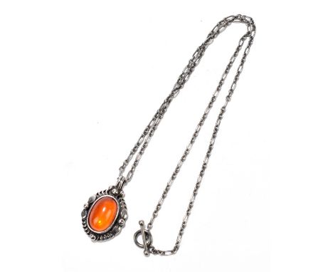 GEORG JENSEN; a sterling silver and amber pendant on fine link chain, length of chain 44cm, length of pendant including fixed