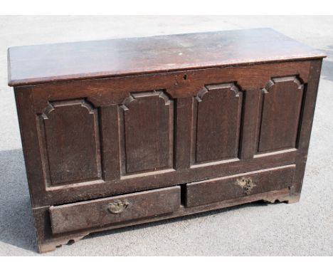 An 18th century oak mule chest with panelled front above two drawers on stile legs, height 84cm, width 143cm, depth 52cm (af)