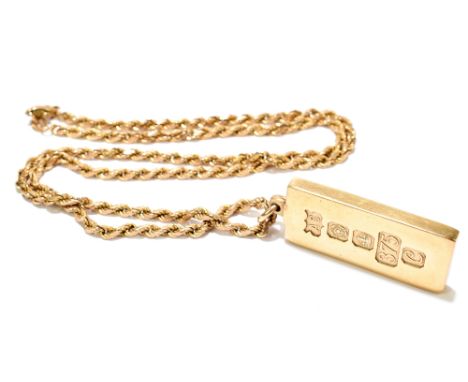 A 9ct yellow gold ingot pendant, Sheffield 1977 suspended on a 9ct yellow gold chain, chain length 50cm, length of pendant in