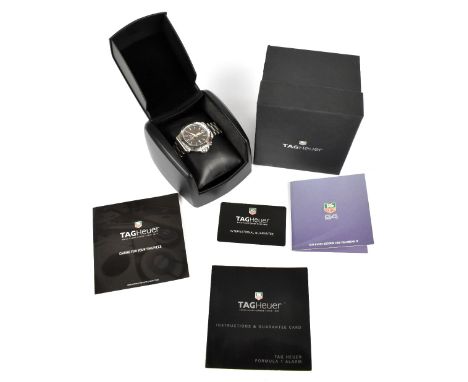 TAG HEUER; a gentleman's stainless steel Formula 1 wristwatch with two piece dial, date aperture and alarm, diameter approx 4