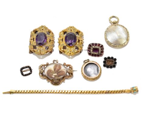 A 19th century garnet and seed pearl set yellow metal brooch, length approx. 2.5cm, with two smaller garnet and yellow metal 