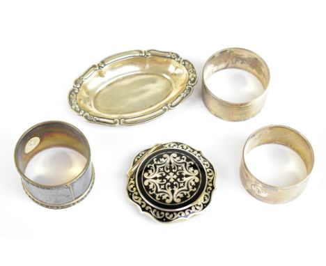 An Austrian sterling silver and black enamel compact of shaped circular form and decorated with foliate motifs, stamped to th