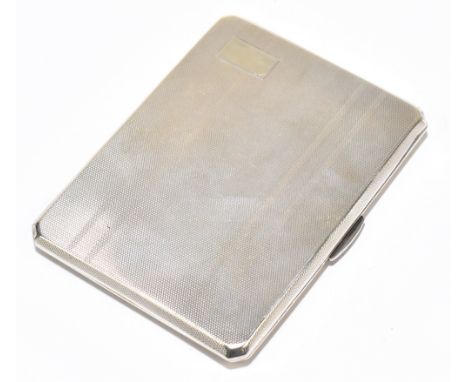 A George VI hallmarked silver cigarette case of rounded rectangular form with engine turned detail, vacant cartouche and insc