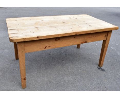 A French style pine farmhouse kitchen table, with rounded&nbsp;rectangular top and a frieze drawer, on tapered square legs,&n