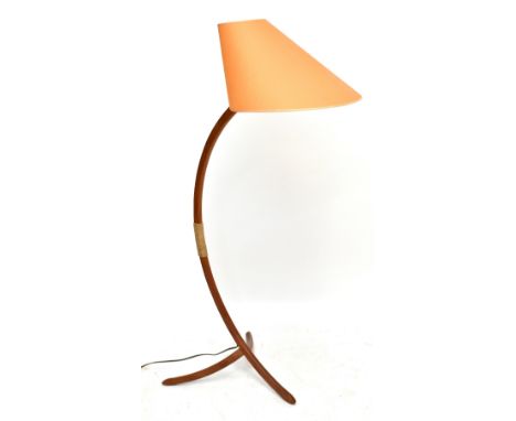 A Swedish teak standard lamp, with bonnet shaped shade, on tri-form base, height 140cm.Additional InformationThe frame with l