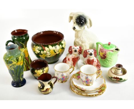 BRETBY; a model of a seated dog, height 27cm, together with a pair of Staffordshire dogs, a Torquay terracotta jardinière, a 