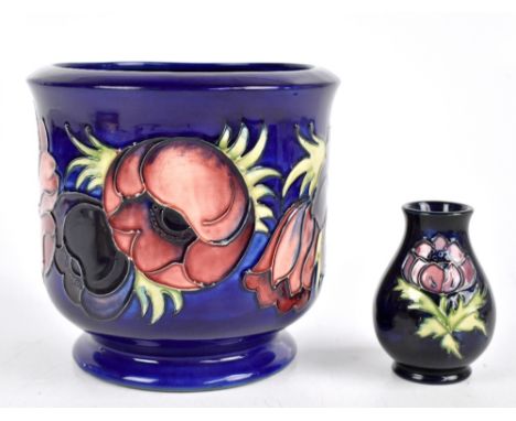 MOORCROFT; a planter decorated in the 'Anemone' pattern on a blue ground, height 17cm, together with a baluster vase decorate