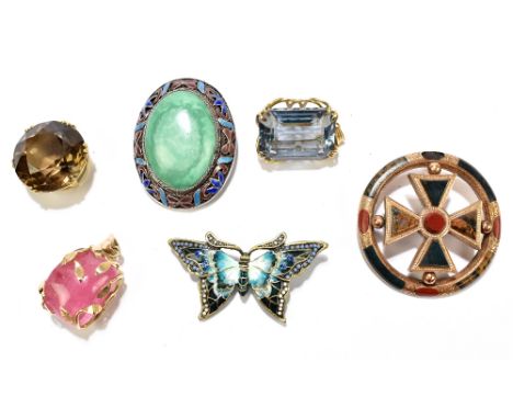 An unusual Scottish yellow metal and hardstone circular brooch featuring coloured stones set to the reverse, diameter 50mm, a