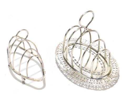 MARTIN, HALL &amp; CO; an Edward VII hallmarked silver four division toast rack on pierced stand, Sheffield 1909, together wi