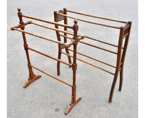 Two Edwardian towel rails, one oak and one stained beech, the tallest 89cm (2).Additional InformationBoth with lighter patche
