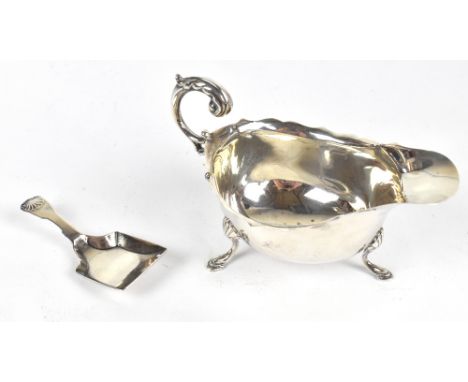 GEORGE UNITE; a Edward VII hallmarked silver circular dish raised on three paw feet, Birmingham 1903, together with a George 