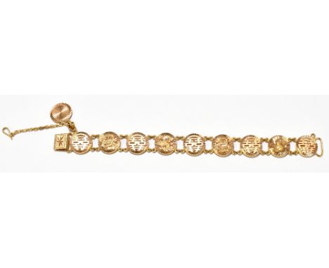 A Chinese yellow metal bracelet formed of circular plaques, four set with an applied dragon with safety chain and engraved dr