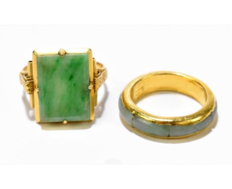 A Chinese yellow metal and polished jade ring size M and a Chinese yellow metal and jade eternity-style ring size I (af) (2).