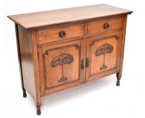 An Art Nouveau walnut sideboard with two drawers and two cupboard doors on turned legs, height 92cm, width 122cm, depth appro
