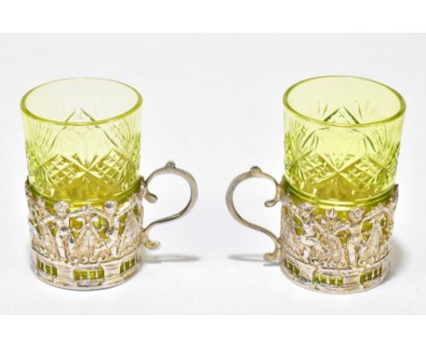 ARMY &amp; NAVY CO-OPERATIVE SOCIETY LTD; a pair of miniature uranium glass beakers/tot cups in Edward VII hallmarked silver 