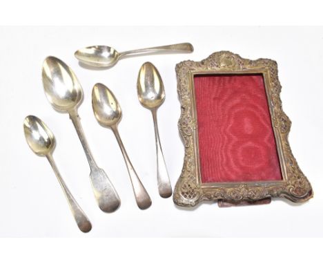 Four George III hallmarked silver Old English pattern spoons, all different makers and dates, with a George IV hallmarked sil