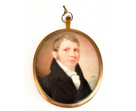 19TH CENTURY BRITISH SCHOOL; watercolour on ivory, portrait miniature, quarter length, of a gentleman wearing a black jacket 