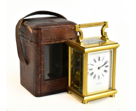 HANHART &amp; CO; a 19th century brass cased repeater carriage clock, the enamelled face bearing Roman numerals, raised on fo