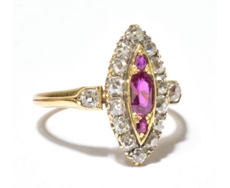 A Victorian diamond and ruby set yellow metal navette shaped ring, with three rubies surrounded by fourteen rose cut diamonds
