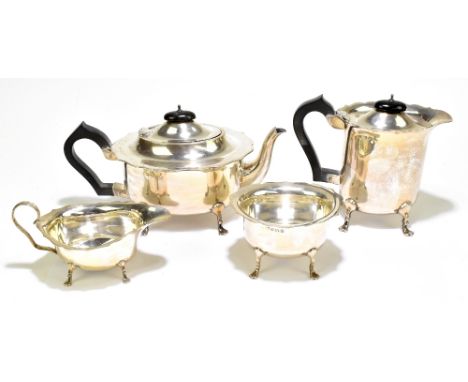 W J MYATT &amp; CO; a George V hallmarked silver four piece tea set, all with shaped rims raised on four lobed feet, the teap