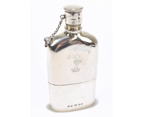 ALFRED TAYLOR; a Victorian hallmarked silver hip flask, with engraved crest of a bird upon a crown to the front and with scre