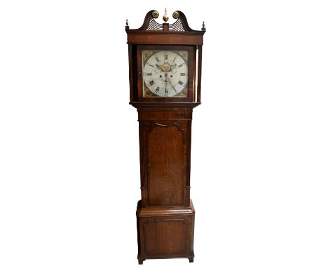 A 19th century oak and mahogany cased longcase clock with brass finial and broken swan neck pediment above painted dial signe