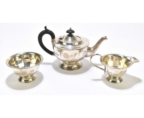 VINERS LTD; a George V&nbsp;hallmarked silver three piece tea service, Sheffield 1930, the teapot with ebonised finial and ha