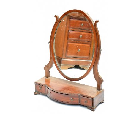 An Edwardian mahogany swing frame toilet mirror, with oval plate on base with three drawers and bracket&nbsp;feet, height 68.