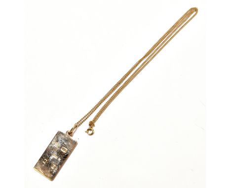 A 9ct gold rectangular pendant, weight approx 6.5g, with a fine link yellow metal chain.Additional InformationSome light mark