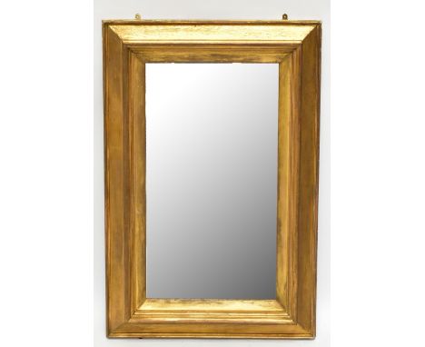 A 19th century giltwood and gesso framed rectangular wall mirror, formerly a picture frame, height 122cm, width 81cm.Addition