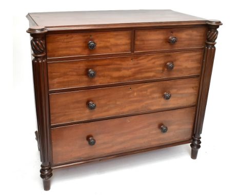 A William IV carved mahogany Scottish chest, with two short and three graduated long drawers, each with a carved flowerhead h