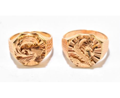 Two similar Chinese yellow metal signet rings both with applied dragons and with engine turned detail to the shoulders, size 