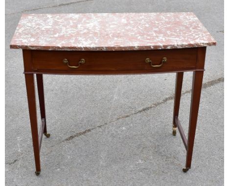 An Edwardian mahogany bowfront wash stand, with veined red marble top above a drawer, on tapered square legs, height approx 7