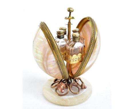 A Victorian gilt metal and mother of pearl shell egg shaped scent bottle case, the sprung mechanism enclosing four faceted gl