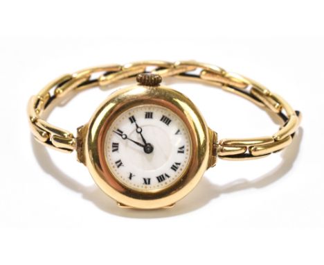A lady's vintage 18ct yellow gold cased wristwatch with white enamel dial set with Roman numerals on expandable spring set br