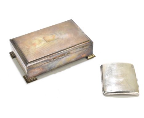 An Elizabeth II hallmarked silver cigarette box of rectangular form, the cover with engine turned detail flanking the central