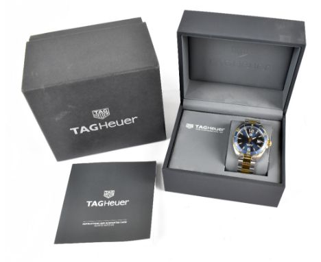 TAG HEUER; a Formula 1 gentleman's stainless steel wristwatch, with blue dial and bezel with date aperture, inscribed 'WAZ112