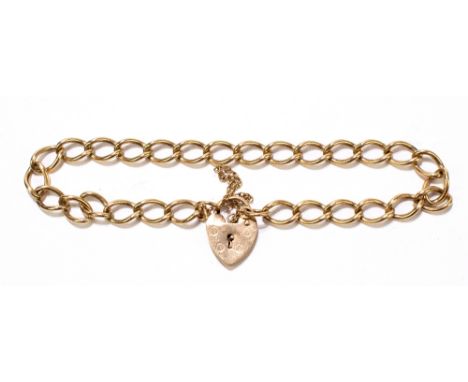 A 9ct gold curb link bracelet, with heart shaped locket and guard chain, approx. 8.5g.Additional InformationGeneral light age