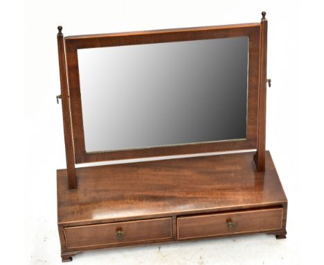 An Edwardian mahogany and inlaid dressing table mirror with two drawers to rectangular base on bracket feet.
