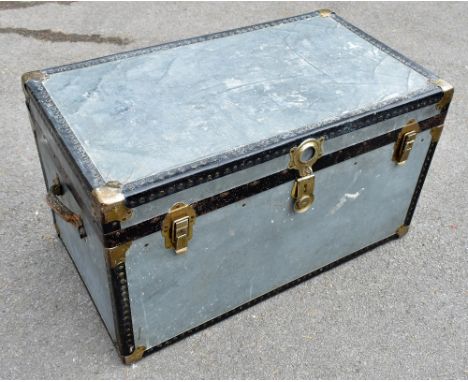 A mid-20th century cabin trunk of rectangular form, with studded detail to the edges and top, width 90cm, depth 52cm, height 