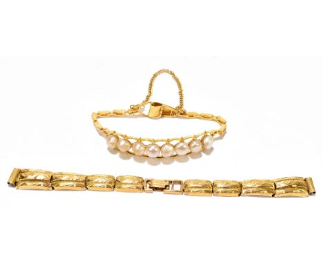 A yellow metal graduated watch strap stamped 22k and a yellow metal and cultured pearl set bracelet with safety chain, the wa