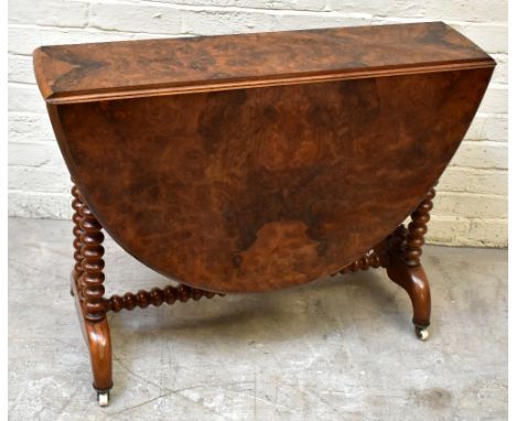 A 19th century walnut drop leaf Sutherland table, raised on bobbin column supports, width 92cm, height 73cm.