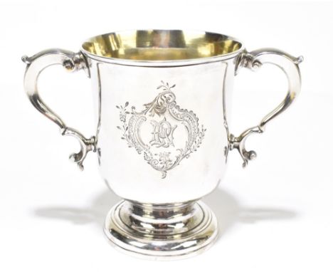 JOHN MOORE; a George III hallmarked silver twin handled loving cup, engraved with initials to a scrolling cartouche to the fr