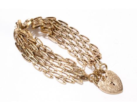 A 9ct yellow gold gate link bracelet with heart clasp, the clasp with chased foliate scroll decoration, approx 33.8g.Addition