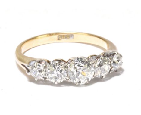 An 18ct yellow gold graduated five stone diamond ring, the central diamond weighing approx 0.70ct, total approx 1.5ct, size N