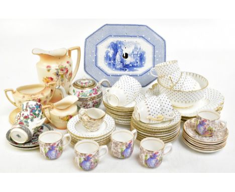A 19th century blue and white transfer printed strainer decorated with architectural features and landscape and a part tea se