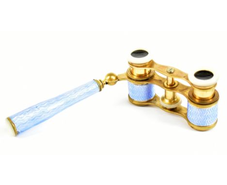 A pair of late 19th century French blue enamel and lacquered brass opera glasses, with mother of pearl detail to the end of t