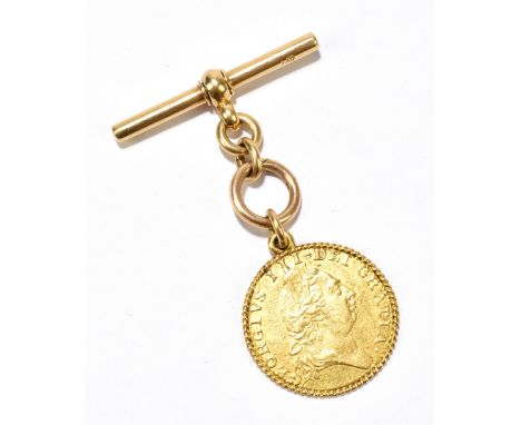 A George III 1787 gold guinea, with spade back and later yellow metal rope twist border and 18ct gold T-bar, weight approx. 1